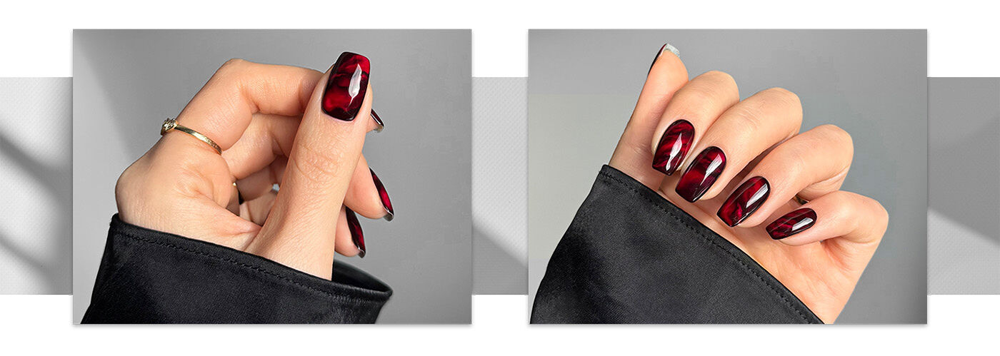 Two different angles of a hand featuring a dimensional and fluid red nail design created by Sarah Haidar.