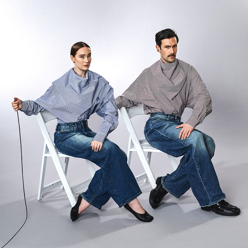 Isabelle Chaput and Nelson Tiberghien, a couple who met in art school and use matching clothes as their medium, look sharp in wide-legged jeans, striped blouses and black leather shoes.