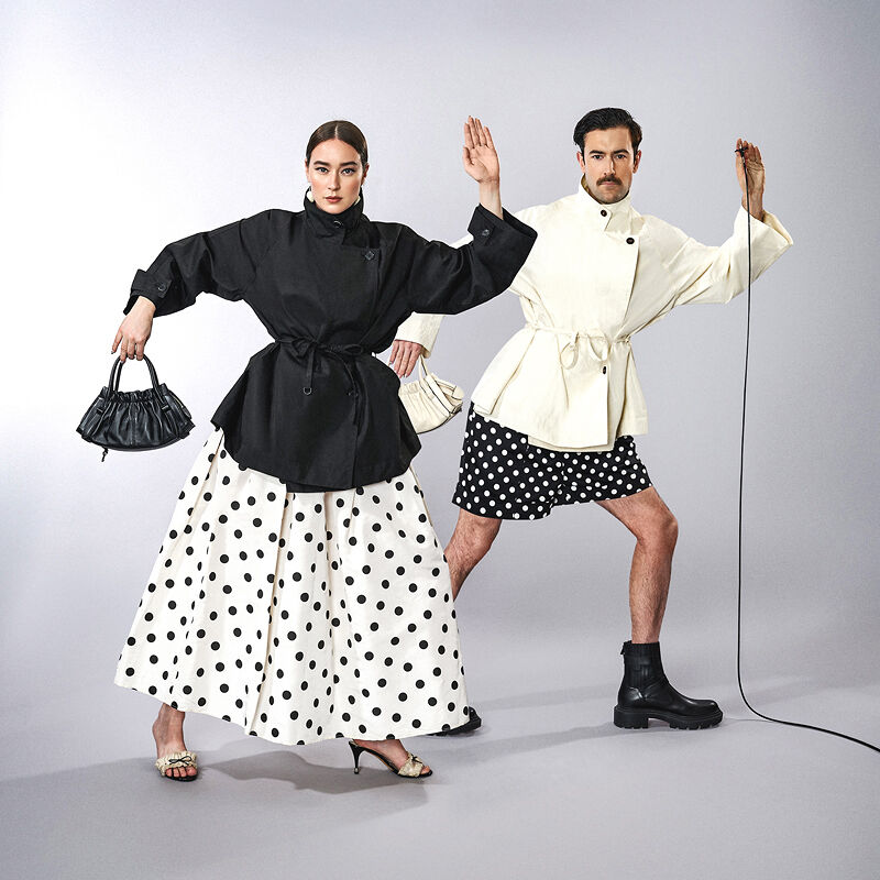 Isabelle Chaput and Nelson Tiberghien, a real-life artistic couple who work together as Young Emperors, advocate for dressing alike in matching black and cream polka dot ensembles.