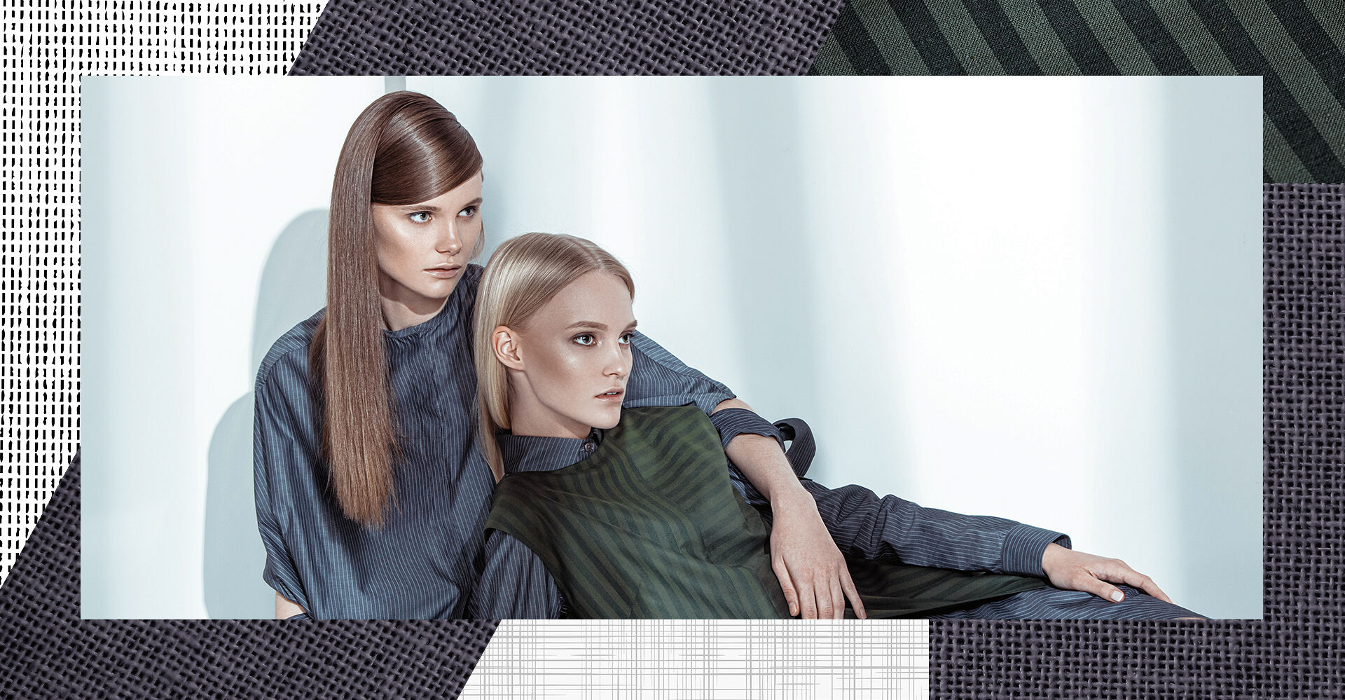 Two models lounge in gray and olive menswear-inspired striped outfits proving that looking professional doesn’t mean dressing plain. 