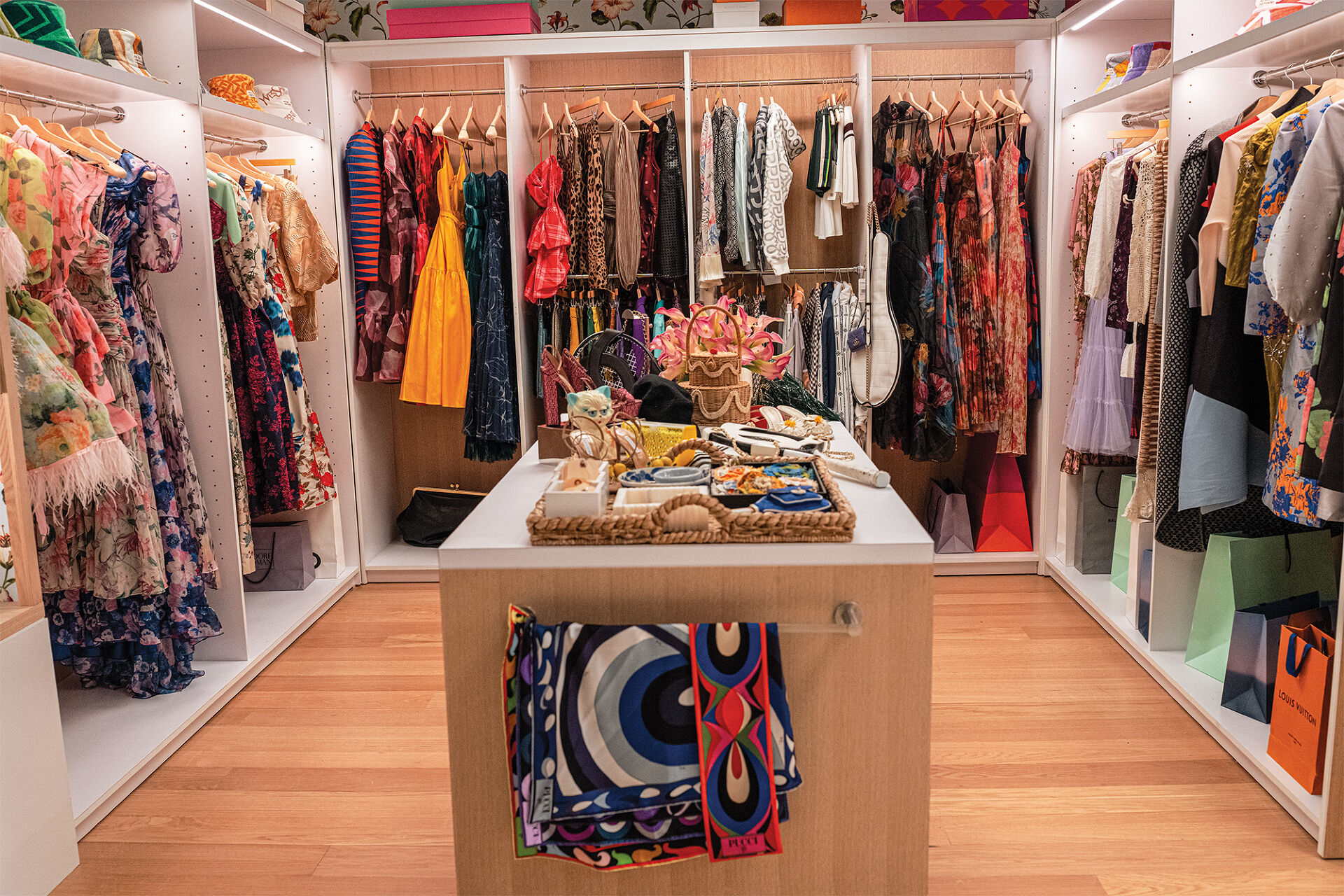 Frilly frocks, flowery fabrics, kitten heels, Chanel tennis gear, blooming broaches and even purses shaped like felines and lemon wedges fill the magical Runway magazine editorial closet.