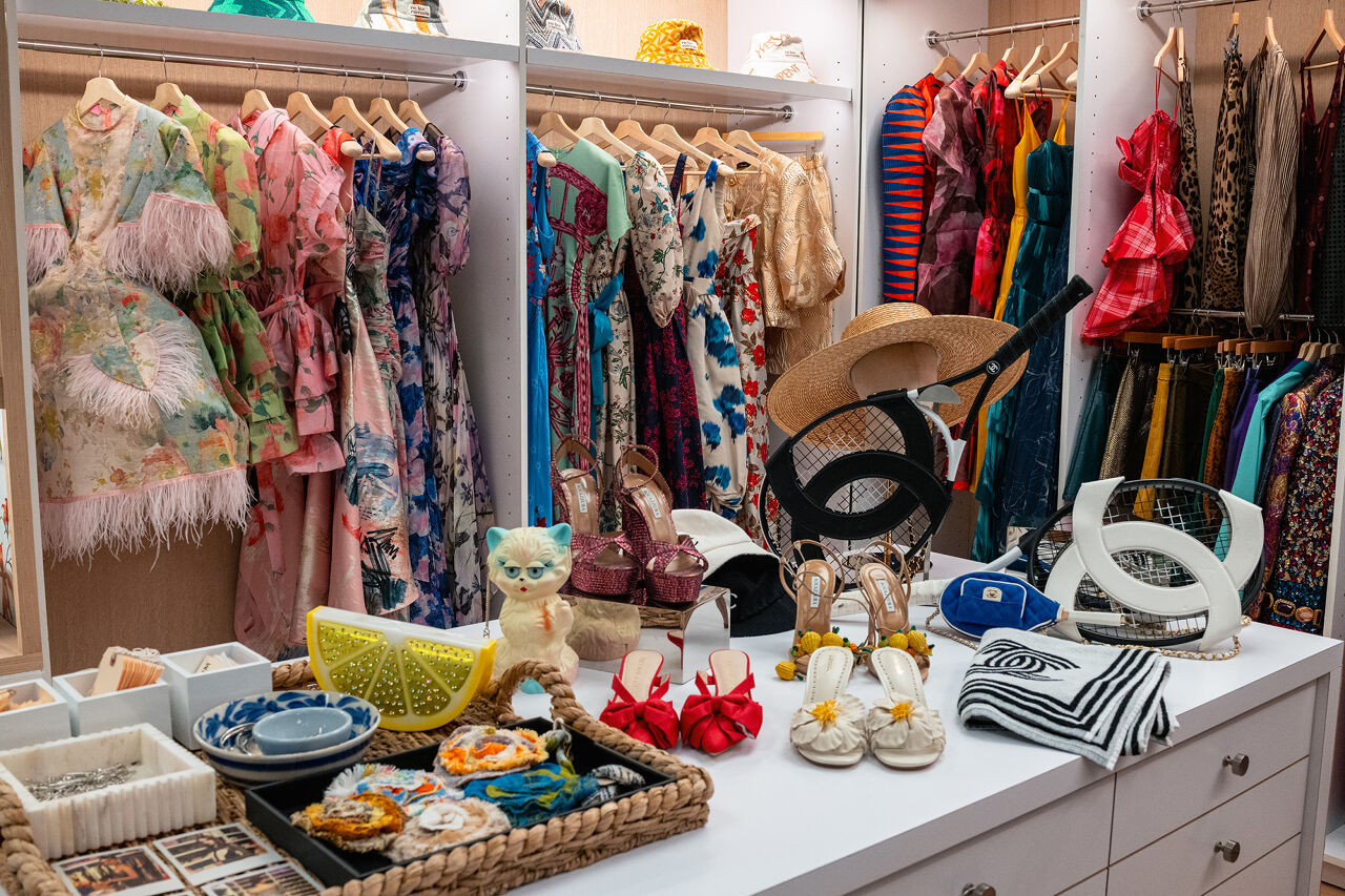 Frilly frocks, flowery fabrics, kitten heels, Chanel tennis gear, blooming broaches and even purses shaped like felines and lemon wedges fill the magical Runway magazine editorial closet.