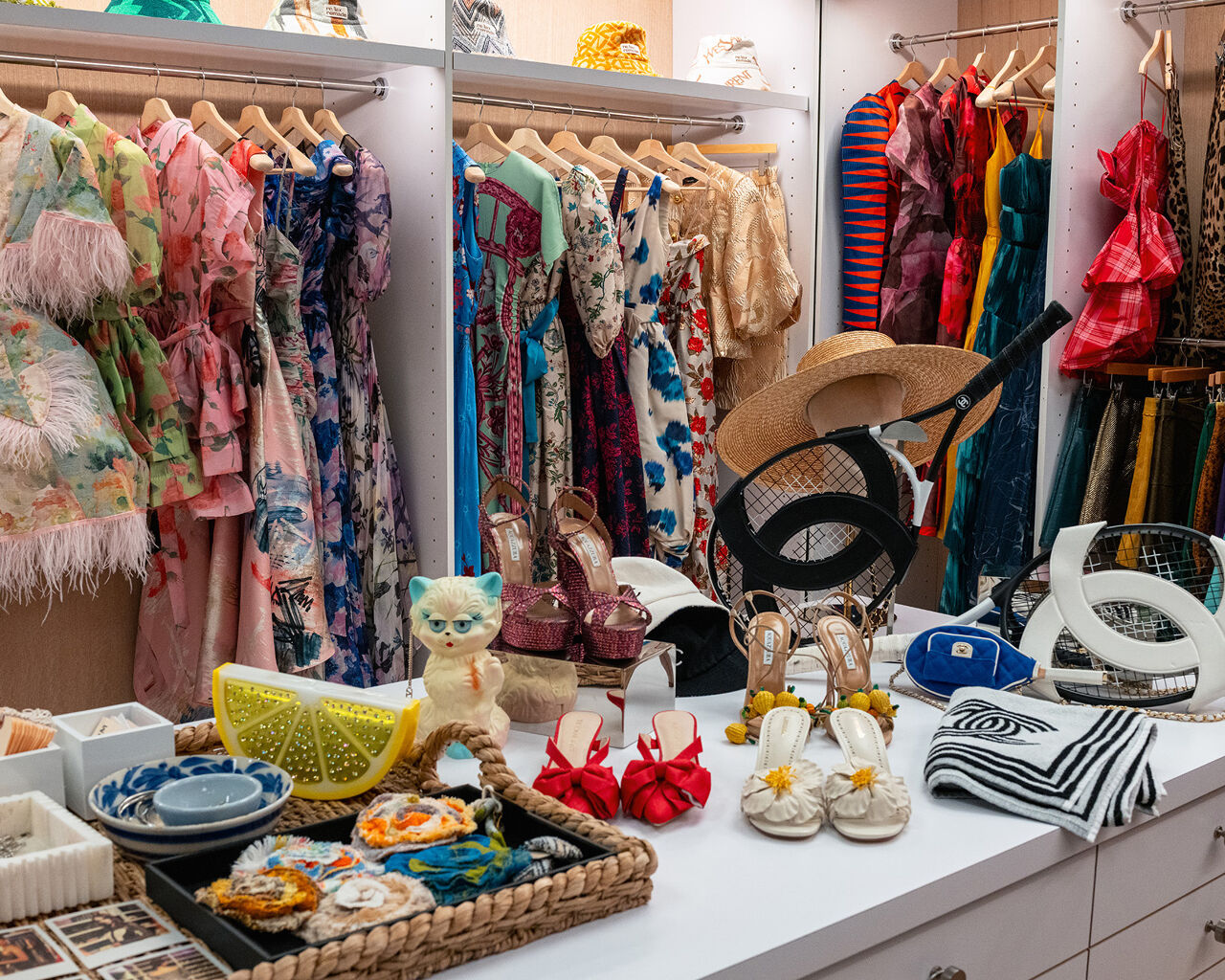 Frilly frocks, flowery fabrics, kitten heels, Chanel tennis gear, blooming broaches and even purses shaped like felines and lemon wedges fill the magical Runway magazine editorial closet.