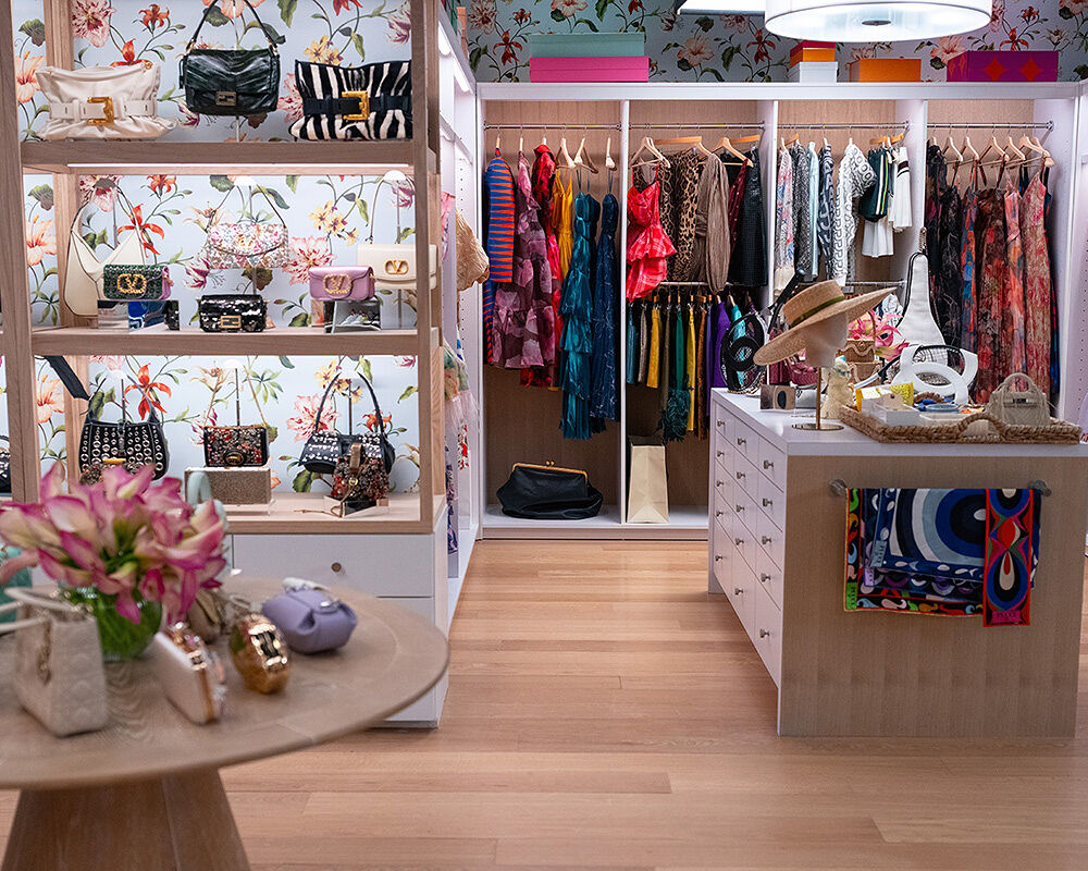 Even the floral wallpaper alerts the editors of Runway magazine that spring has sprung inside the iconic closet where Miranda Priestly decides what fashionistas will be coveting this season. Tiny clutches, colorful scarves, floral dresses and wide-brimmed hats wait to be deemed trendy.