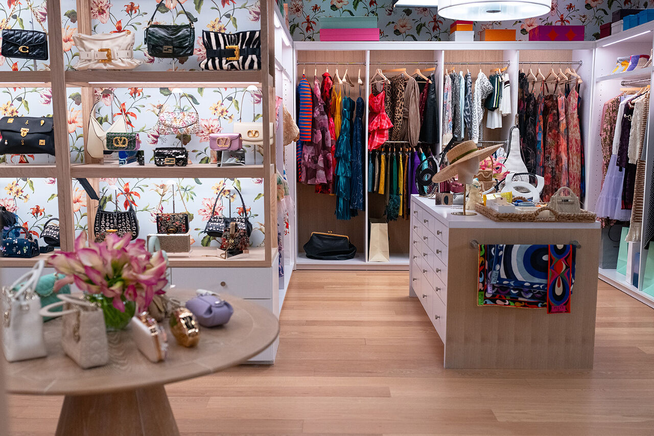 Even the floral wallpaper alerts the editors of Runway magazine that spring has sprung inside the iconic closet where Miranda Priestly decides what fashionistas will be coveting this season. Tiny clutches, colorful scarves, floral dresses and wide-brimmed hats wait to be deemed trendy.