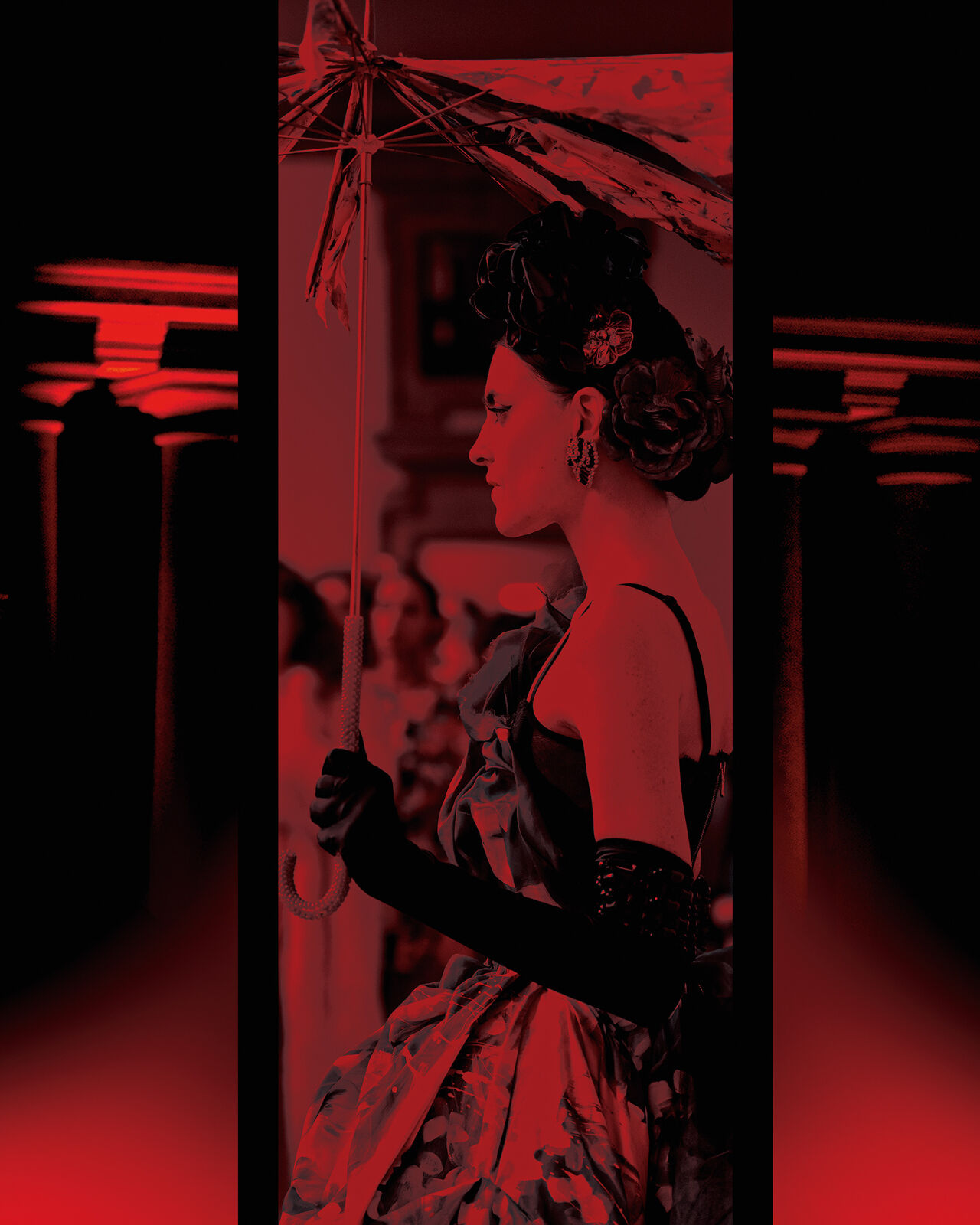 A model in opera gloves carrying a tattered umbrella is bathed in mysterious red glow at the Runway Milan Fashion Week show.