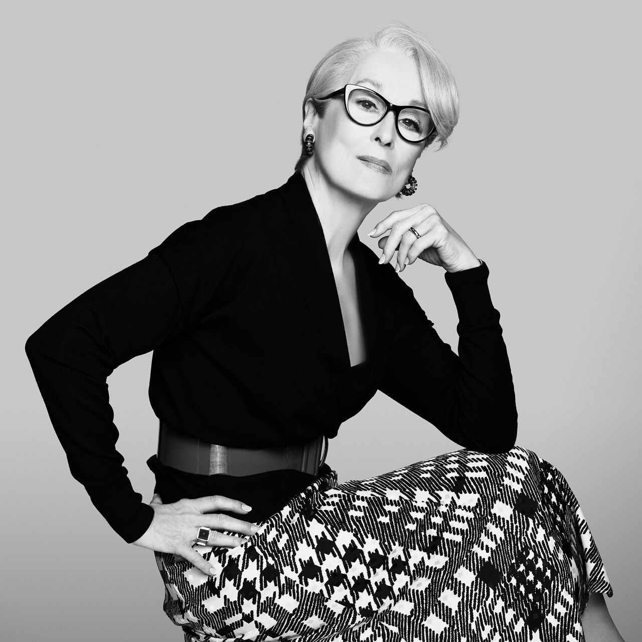 Miranda Priestly looks distinguished in the belted black sweater and houndstooth-patterned skirt she wore for her “Editor’s Letter” portrait found in the May issue of Runway magazine.