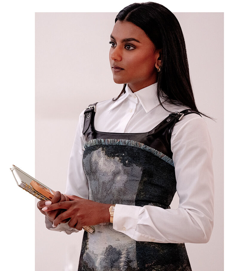 Amari Mari, the new first assistant of Runway magazine editor Miranda Priestly, stands at the ready, phone and notebook in hand, to ensure her boss’ day runs smoothly and on schedule.