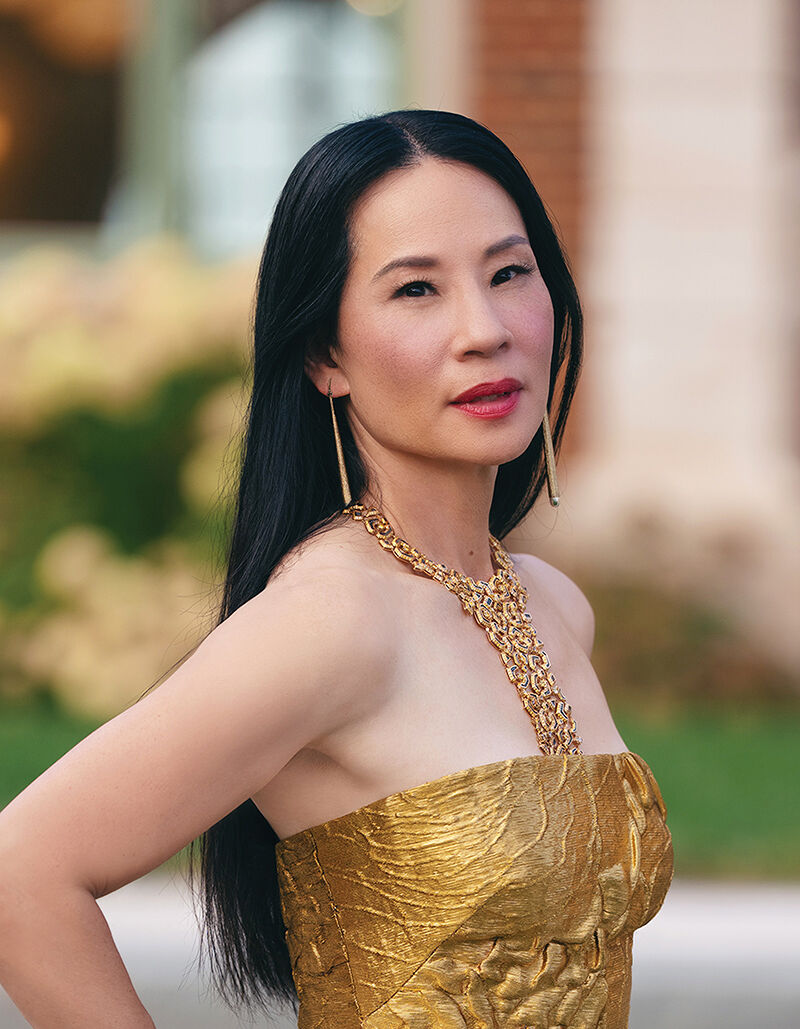 Sasha Barnes looks good as gold in a strapless gold gown.