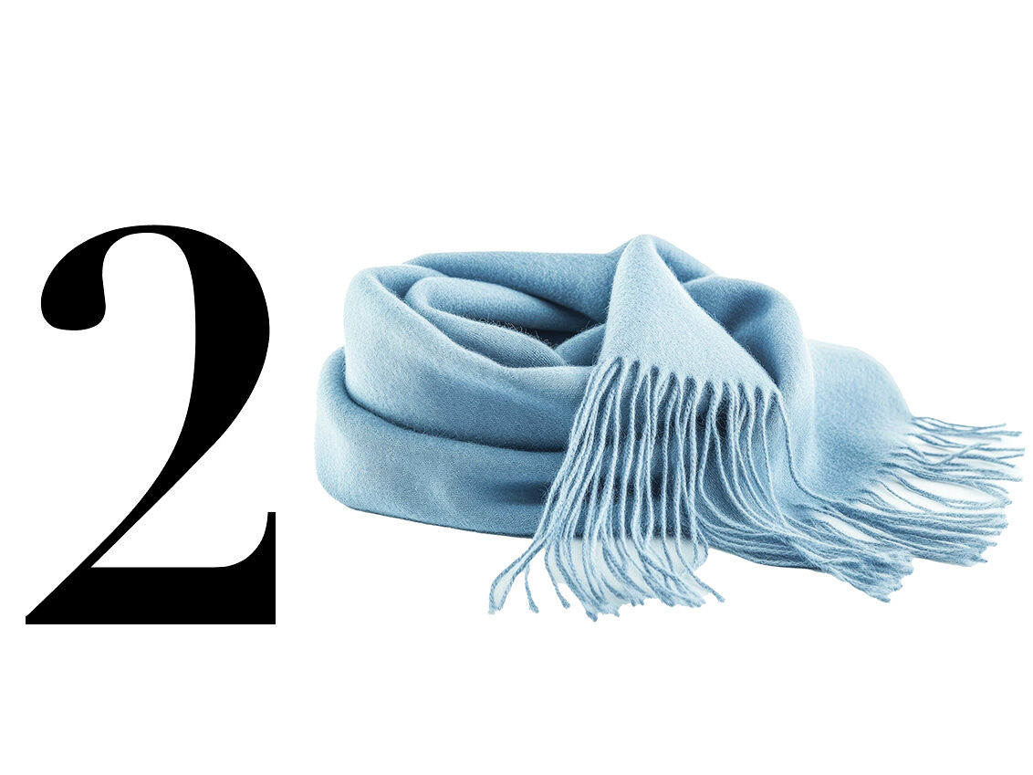 A cerulean cashmere scarf adds a pop of color to any outfit of the day and provides warmth on chilly Lake Como evenings.
